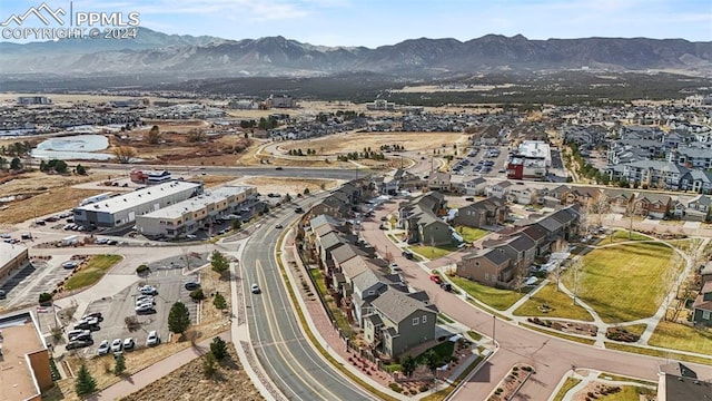 birds eye view of property with a mountain view