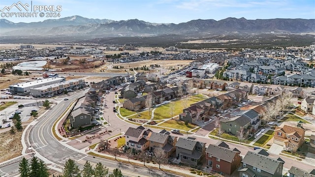 birds eye view of property featuring a mountain view