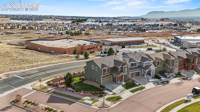 birds eye view of property featuring a mountain view