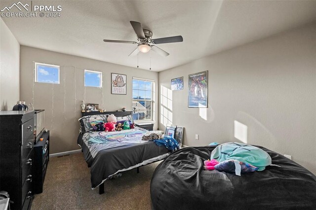 carpeted bedroom with ceiling fan