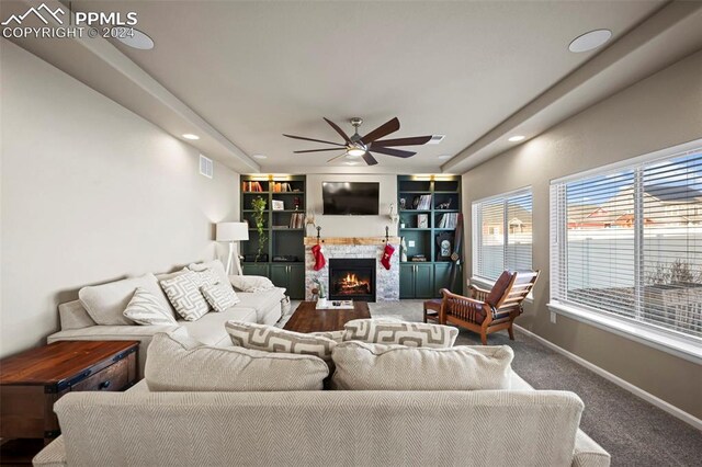 living room featuring carpet floors and ceiling fan