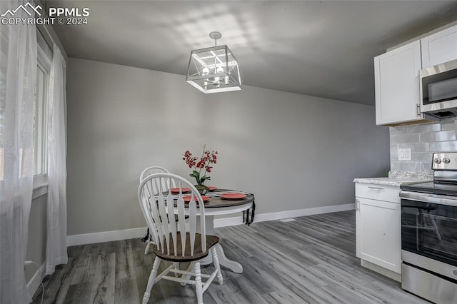 dining space featuring light wood-type flooring