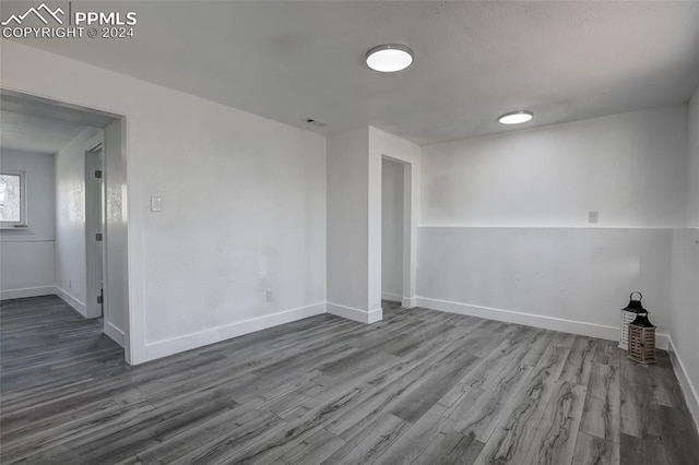 empty room featuring hardwood / wood-style flooring