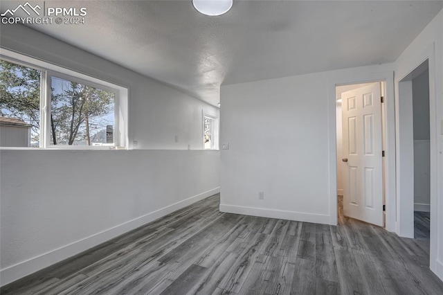 spare room featuring dark hardwood / wood-style floors