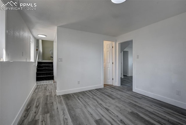 spare room with wood-type flooring