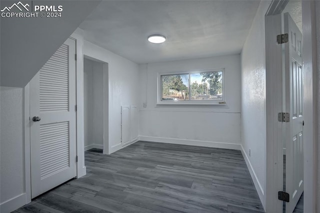 bonus room with dark hardwood / wood-style flooring