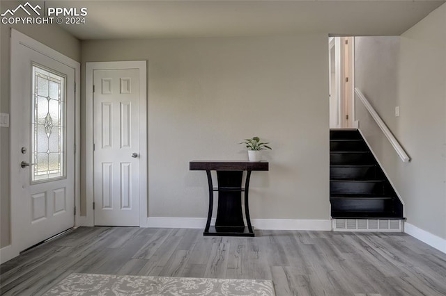 entryway with light hardwood / wood-style floors