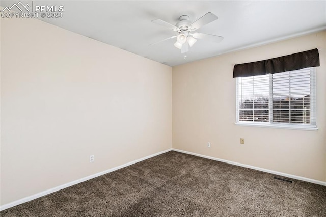 empty room with carpet and ceiling fan