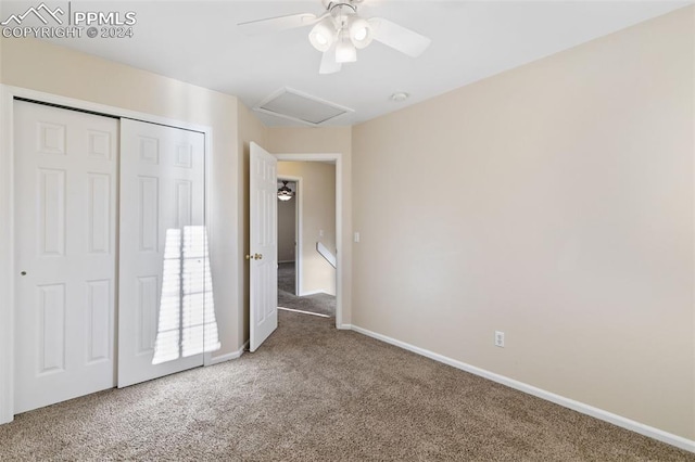 unfurnished bedroom featuring carpet, a closet, and ceiling fan