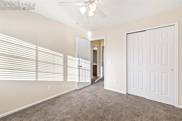 unfurnished bedroom with carpet floors, a closet, and ceiling fan