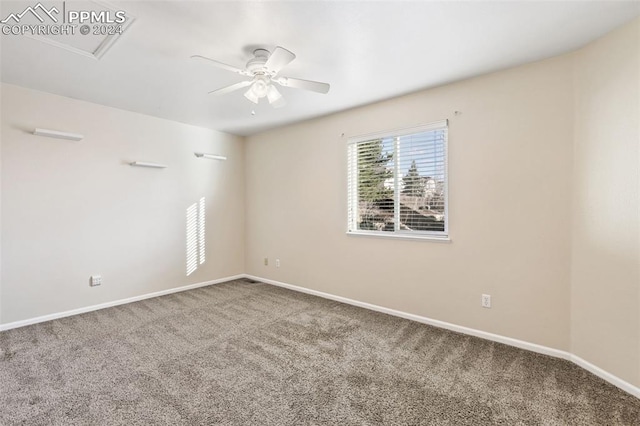 unfurnished room featuring ceiling fan and carpet floors