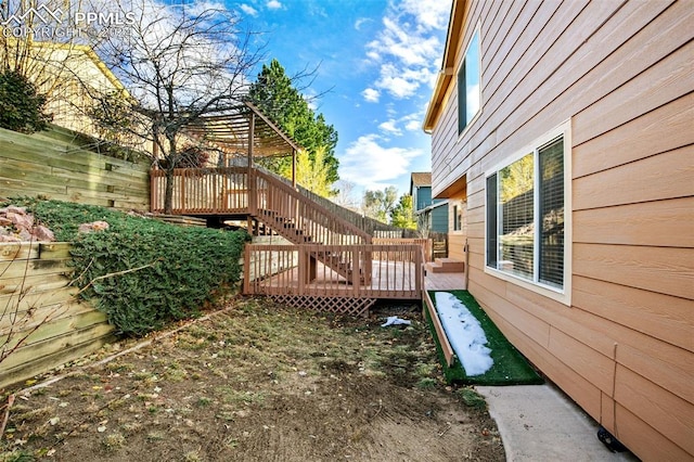 view of yard featuring a wooden deck