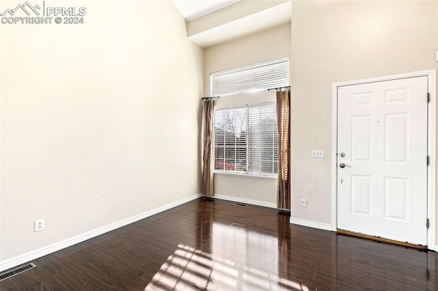 foyer with dark hardwood / wood-style floors