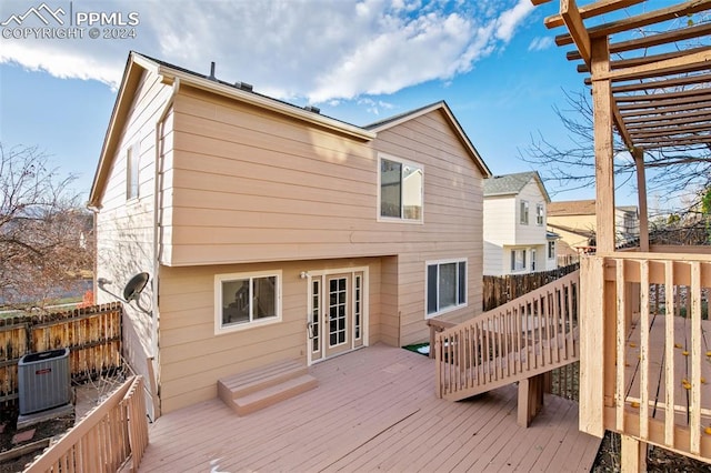 wooden deck featuring a pergola and cooling unit