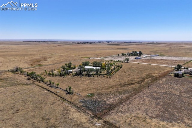 birds eye view of property with a rural view