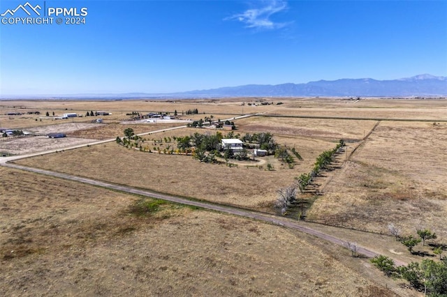 aerial view featuring a mountain view and a rural view