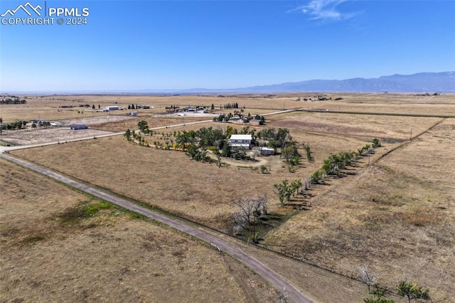 aerial view featuring a mountain view and a rural view