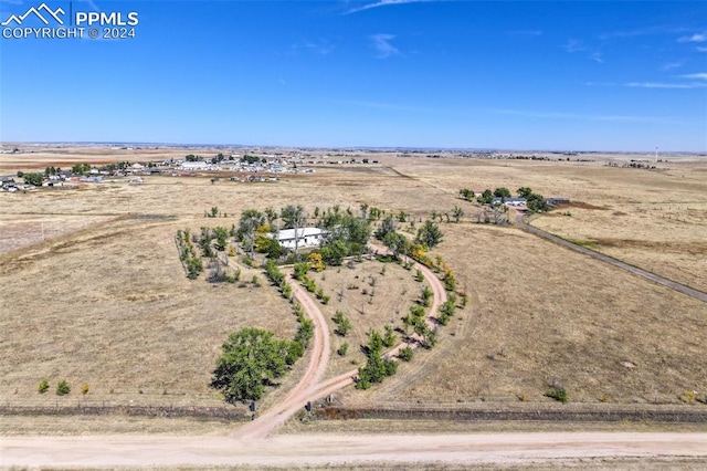 birds eye view of property with a rural view