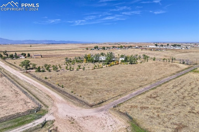 birds eye view of property with a rural view