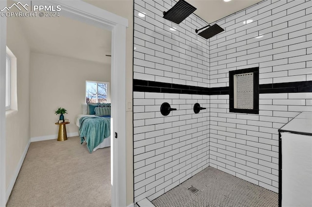 bathroom with a tile shower