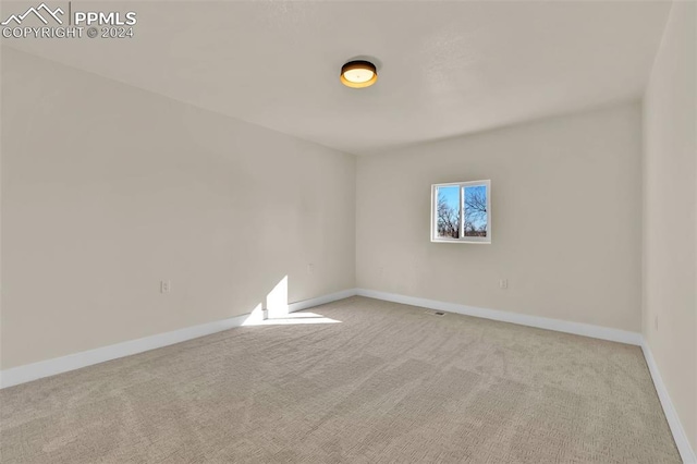 view of carpeted spare room