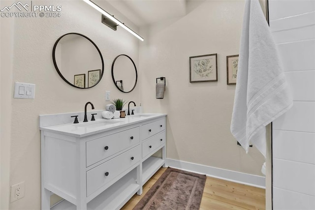 bathroom featuring vanity and wood-type flooring