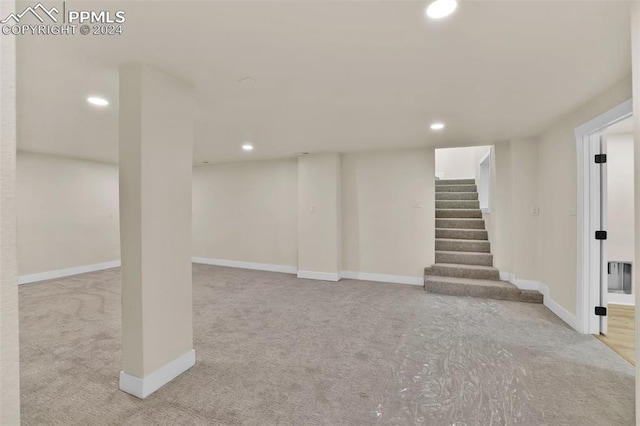 basement with light colored carpet