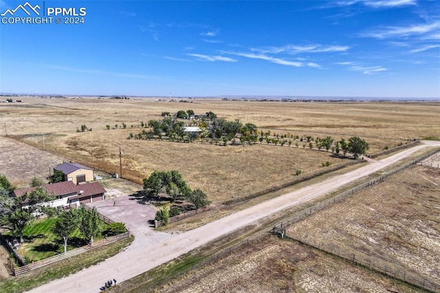 birds eye view of property with a rural view