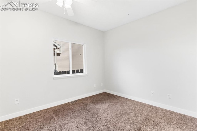 empty room with carpet flooring and ceiling fan