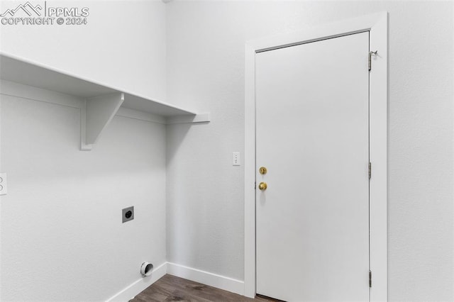 clothes washing area with dark hardwood / wood-style flooring and electric dryer hookup