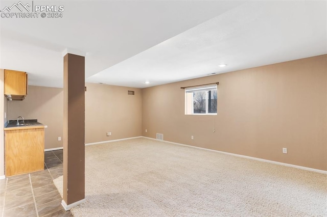 interior space with light colored carpet and sink