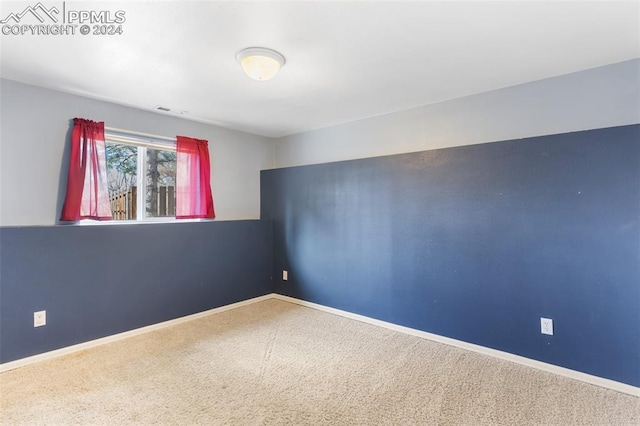 unfurnished room featuring carpet flooring