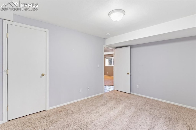 unfurnished room featuring carpet floors