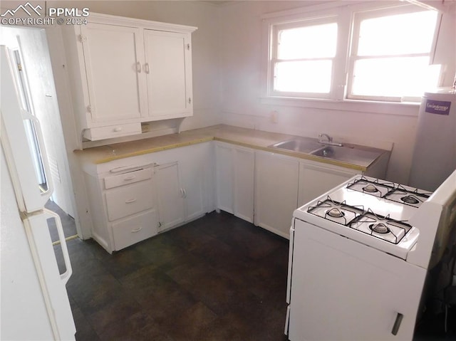 kitchen featuring white cabinets and white appliances