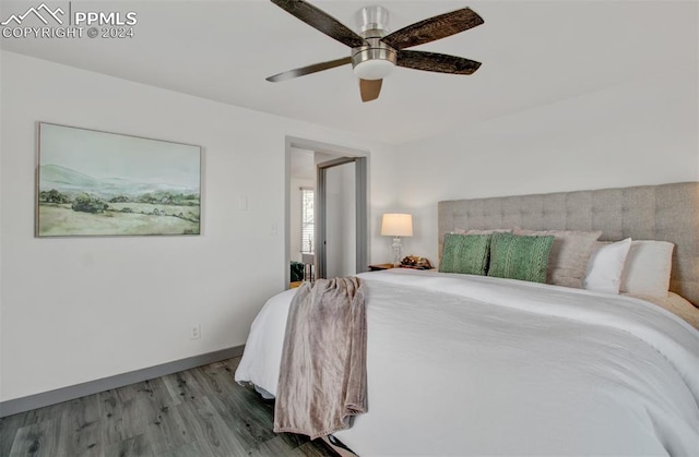 bedroom with ceiling fan and light hardwood / wood-style floors