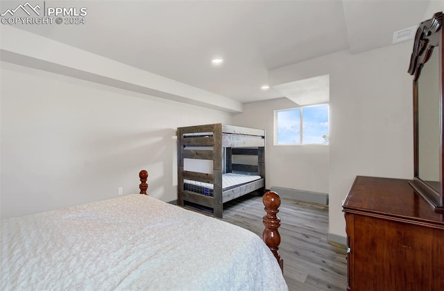 bedroom with hardwood / wood-style flooring