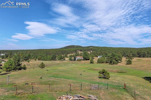 mountain view featuring a rural view