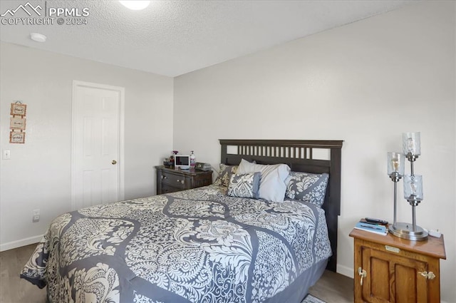 bedroom featuring a textured ceiling