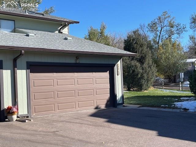 garage with a lawn