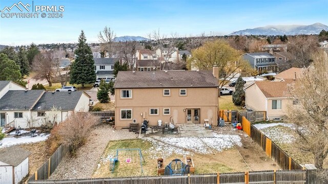 birds eye view of property with a mountain view