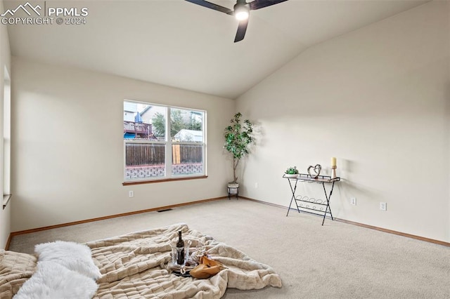 bedroom with ceiling fan, carpet, and lofted ceiling