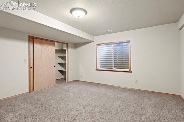 unfurnished bedroom with carpet floors