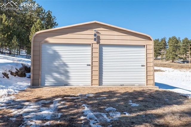 view of snow covered garage