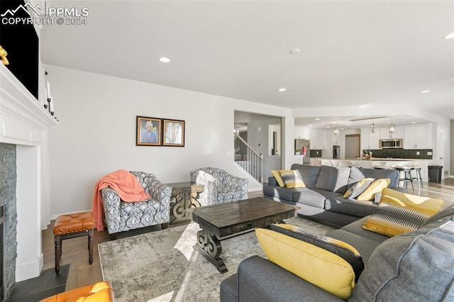 living room with a fireplace and hardwood / wood-style flooring