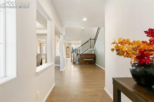 hall with light hardwood / wood-style floors