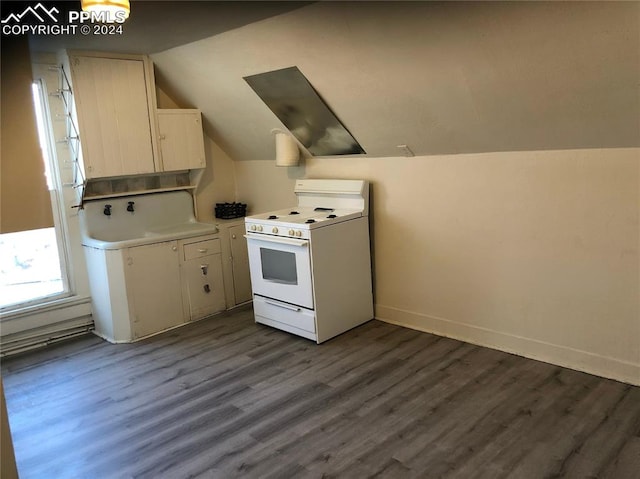 kitchen featuring white range oven, vaulted ceiling, and dark hardwood / wood-style floors