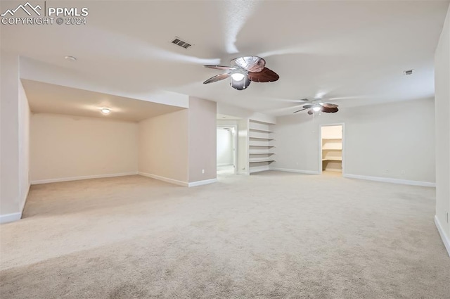 unfurnished living room with light carpet and ceiling fan