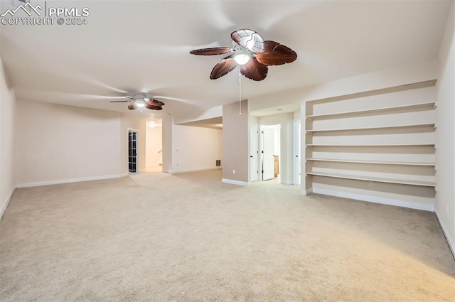 interior space featuring ceiling fan and light carpet