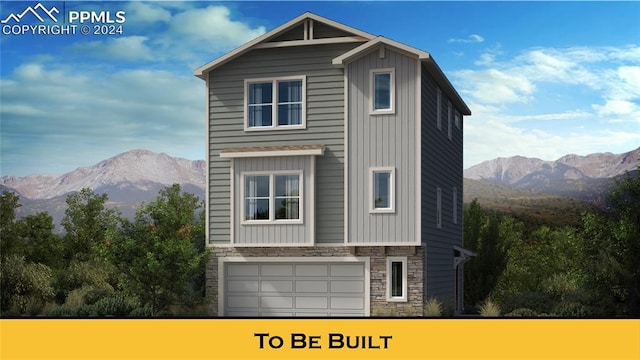 exterior space with a mountain view and a garage