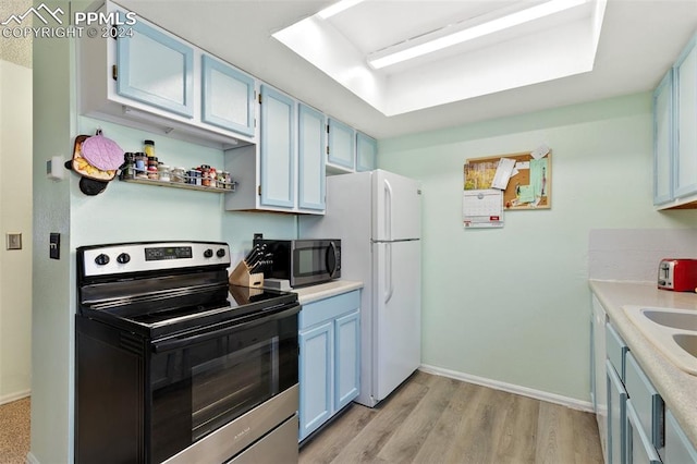 kitchen featuring light wood-type flooring, blue cabinets, and appliances with stainless steel finishes